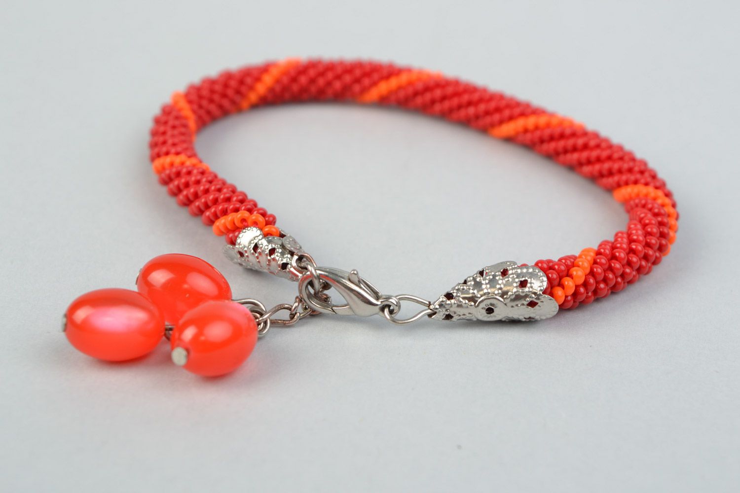 Handmade designer wrist bracelet woven of Czech beads in red color palette photo 4