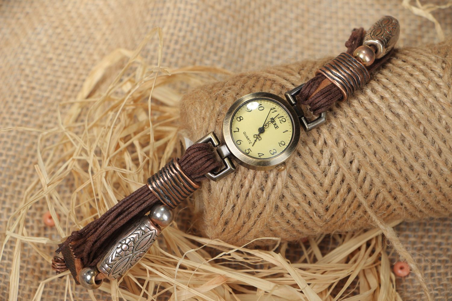 Wristwatch with a narrow brown handmade strap made of waxed cord photo 1
