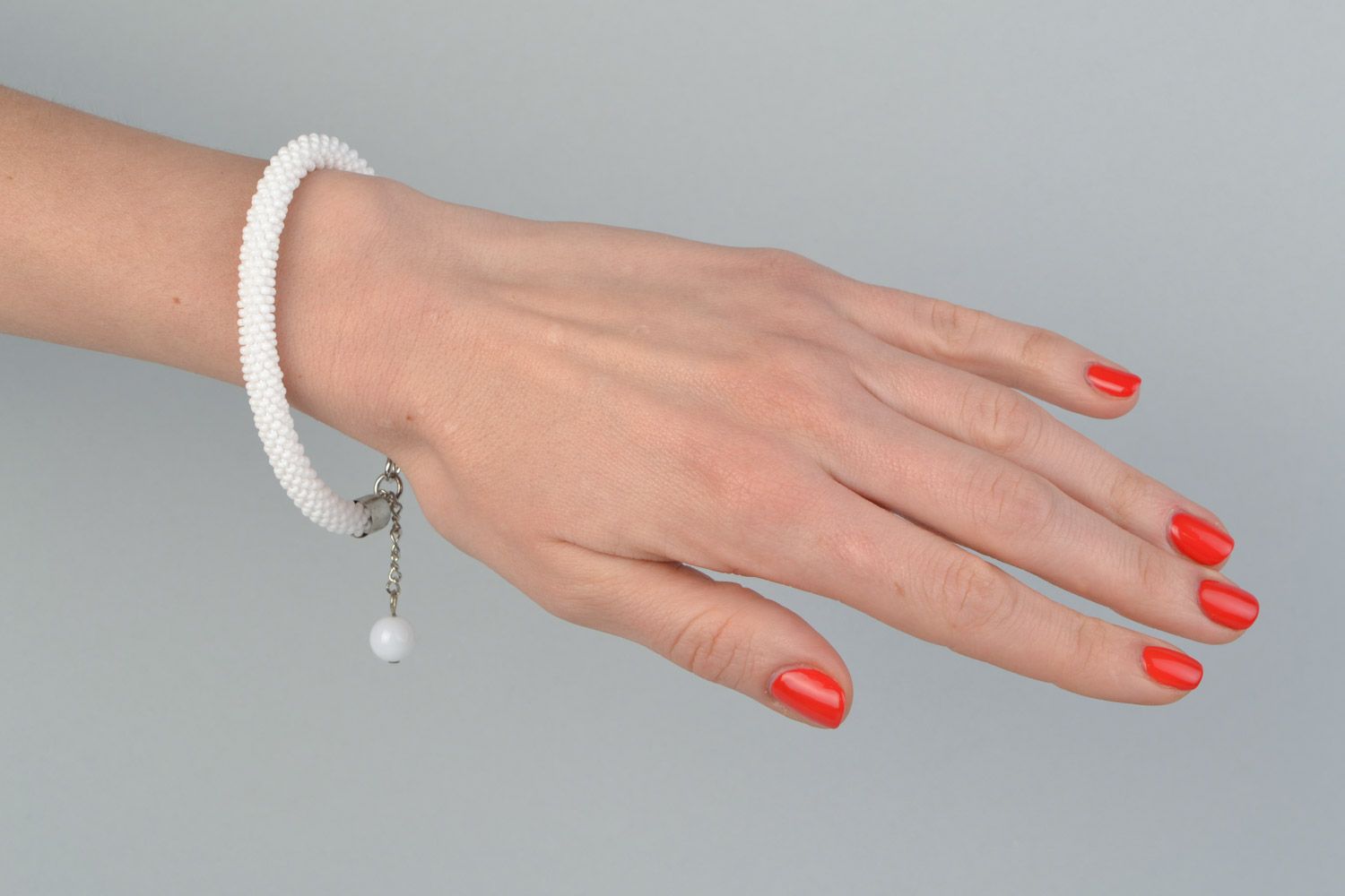 Handmade festive wrist cord bracelet crocheted of Czech beads in white color photo 1