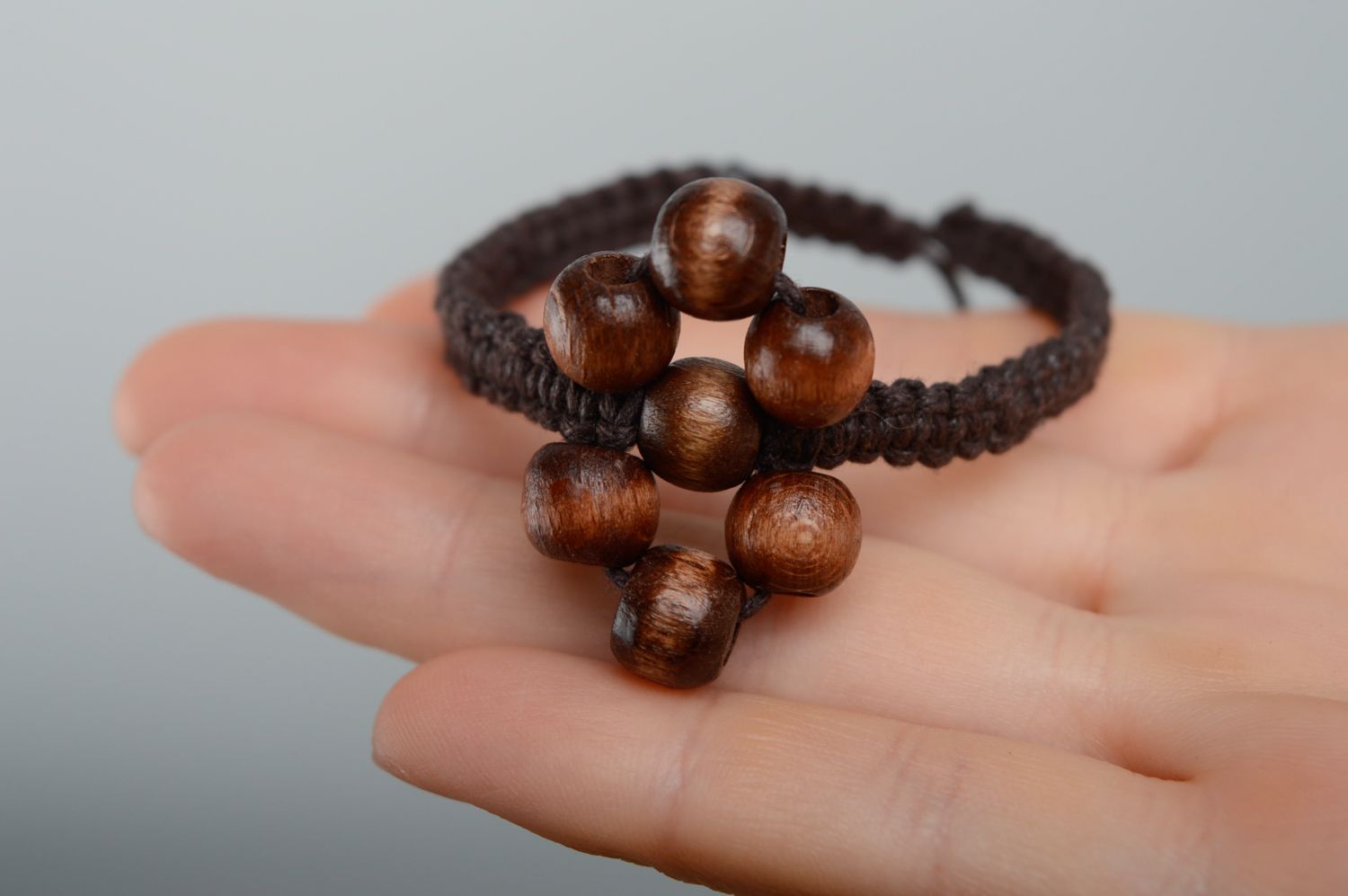 Unusual macrame bracelet of brown color with wooden beads photo 3