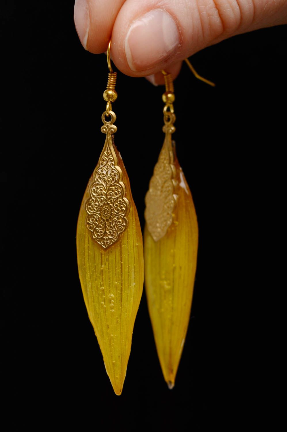 Epoxy long earrings with natural sunflower petals photo 3