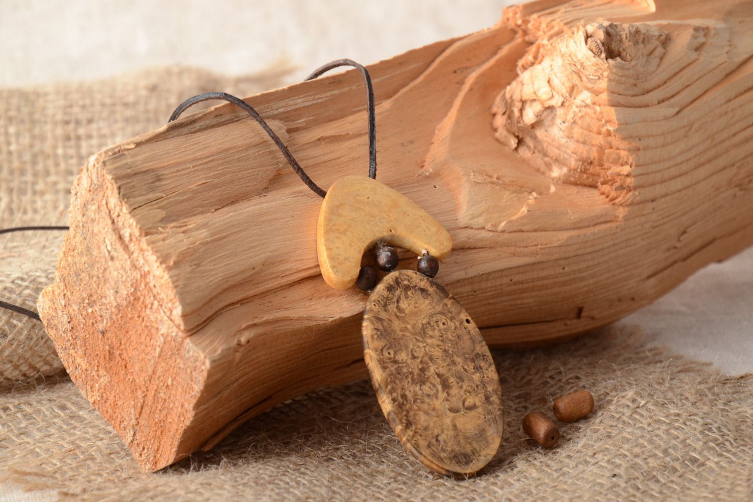 Handmade tinted oval neck pendant carved of wood with intarsia for women photo 1