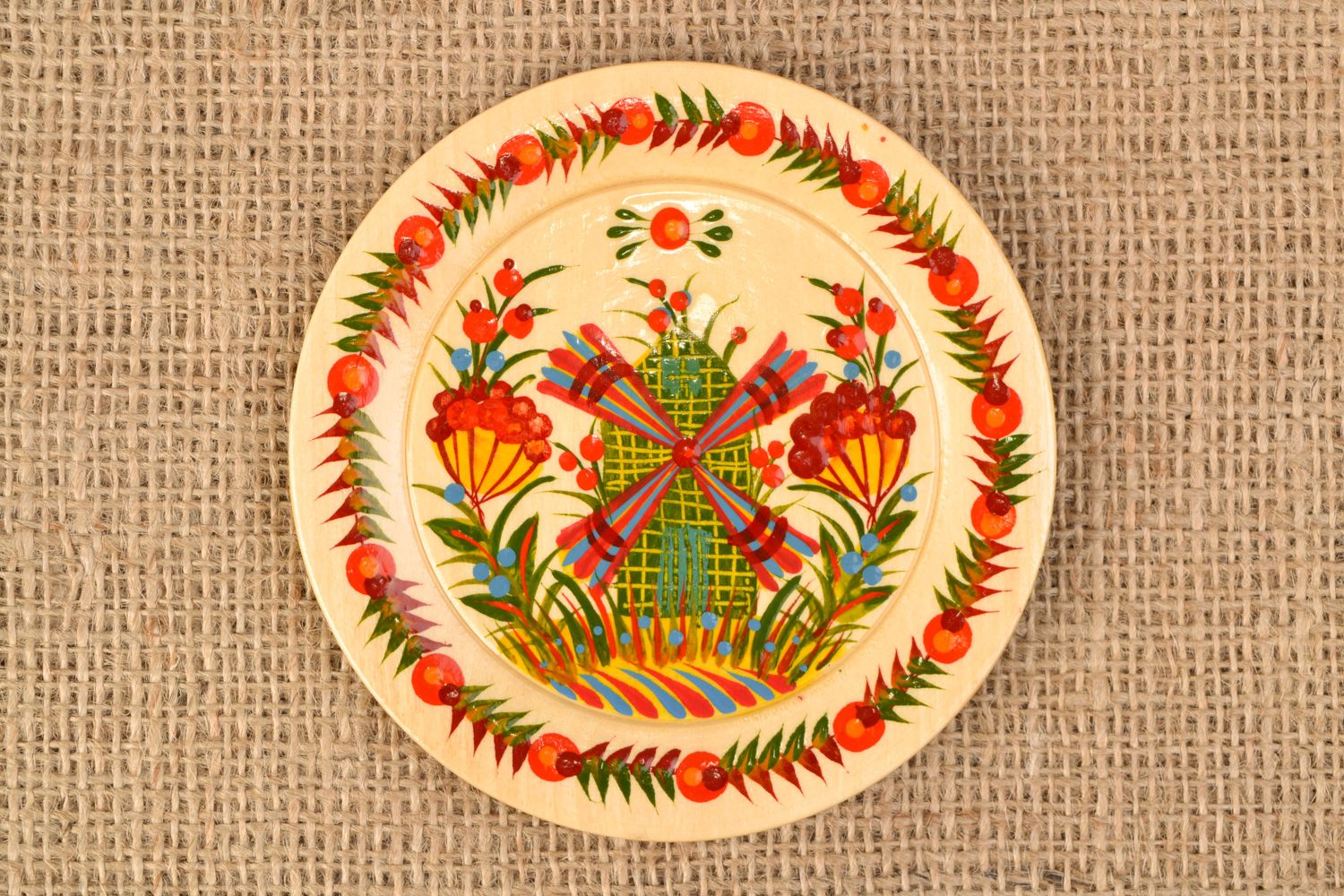 Handmade decorative carved wooden plate with traditional Petrikivka painting photo 1