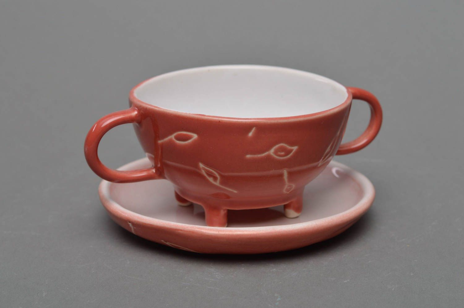 Pink porcelain cup with two handles and round saucer photo 1