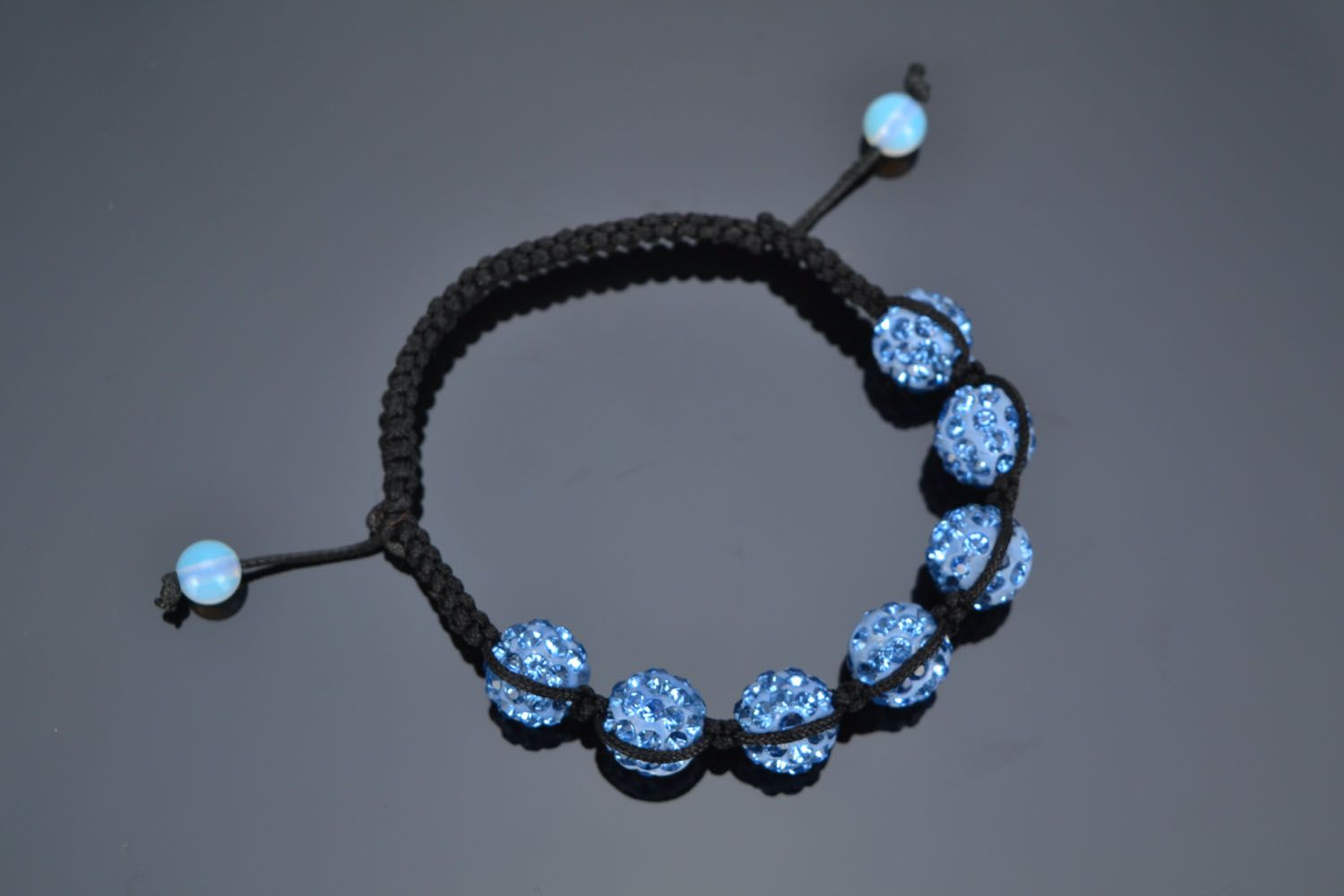 Bracelet made of blue beads and cord photo 2