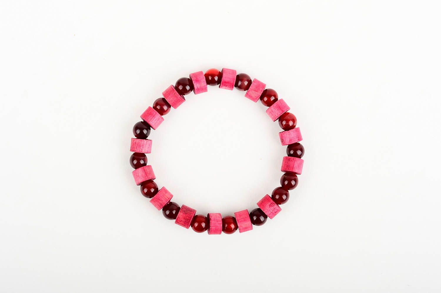 The wide wooden handmade beaded bracelet with dark red and light red beads on elastic cord photo 1