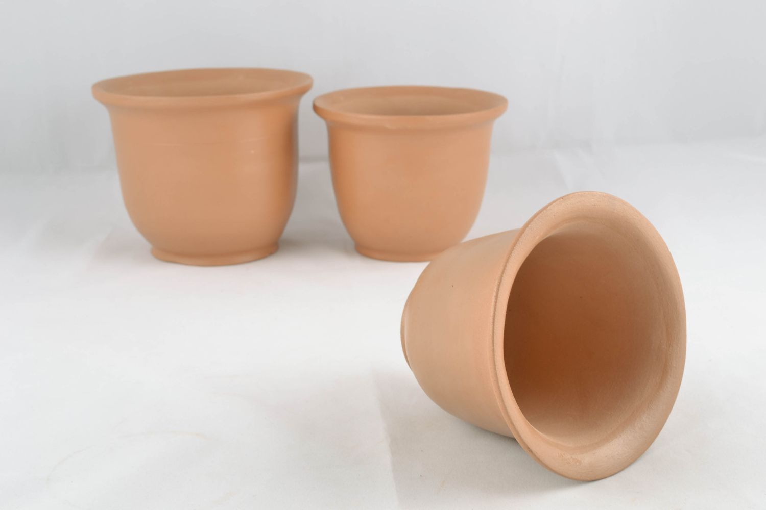 Unglazed ceramic plant pot photo 1