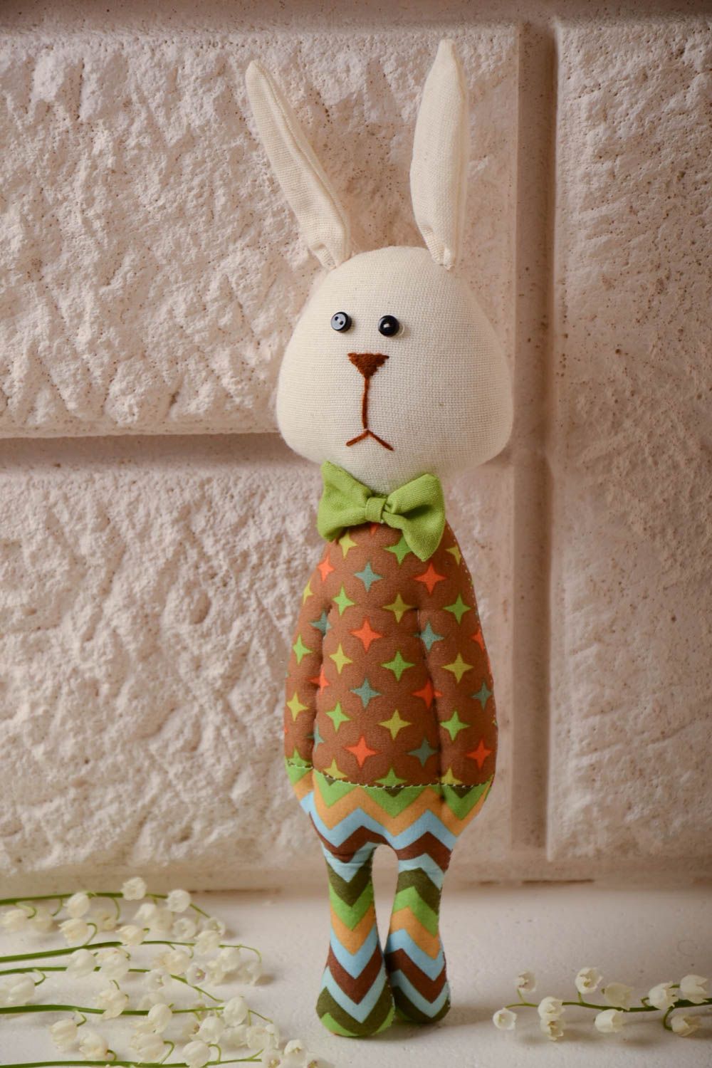 Handmade cotton fabric soft toy funny rabbit in colorful suit with green bow tie photo 1