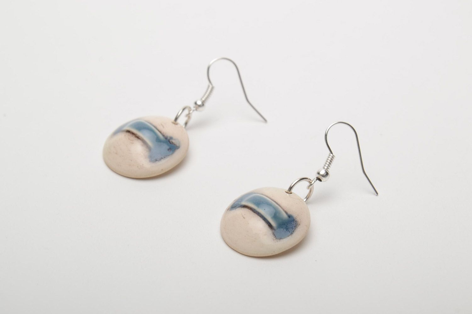 Handmade laconic beige round dangle ceramic earrings painted with enamels photo 3