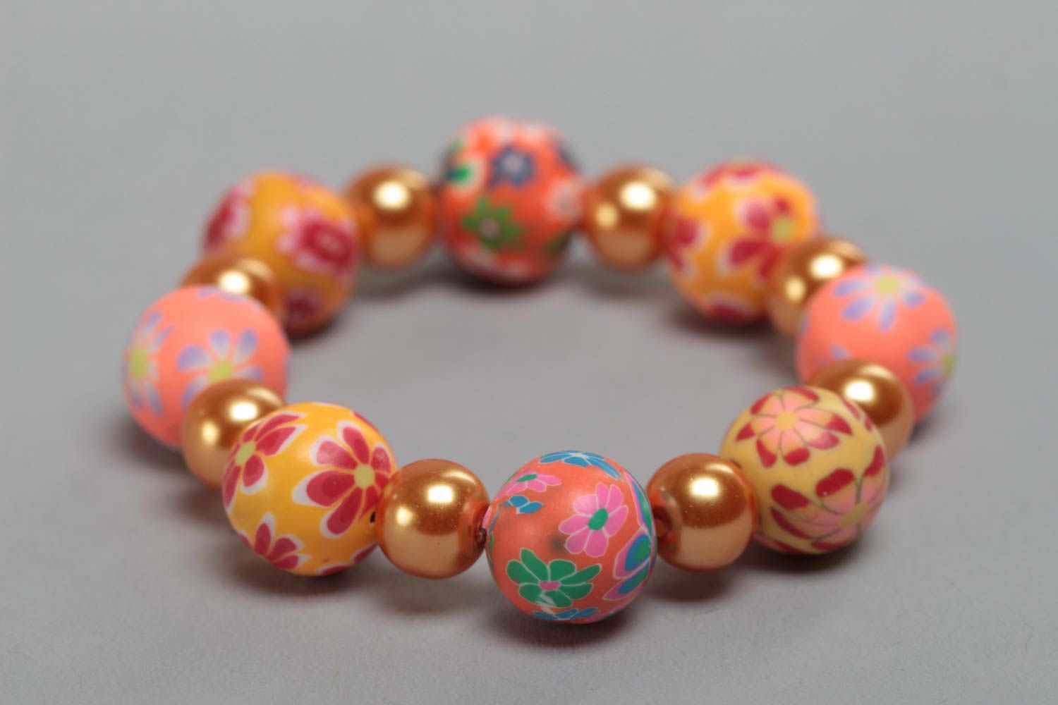 Orange handmade children's bracelet created of polymer clay and ceramic beads photo 2