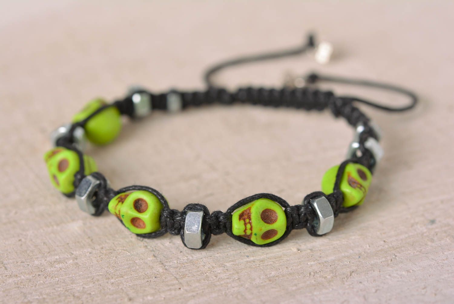 Handmade light green skull color beaded black cord bracelet with female screws photo 1