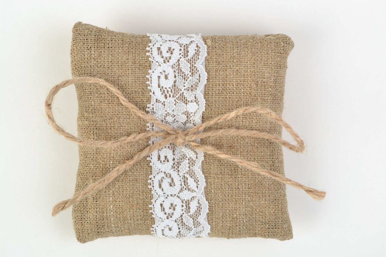 Handmade ethnic rings bearer pillow sewn of burlap with white lace and cord  photo 4