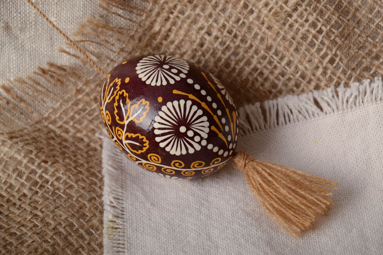 Handmade decorative wall hanging brown and beige painted Easter egg with tassel photo 1