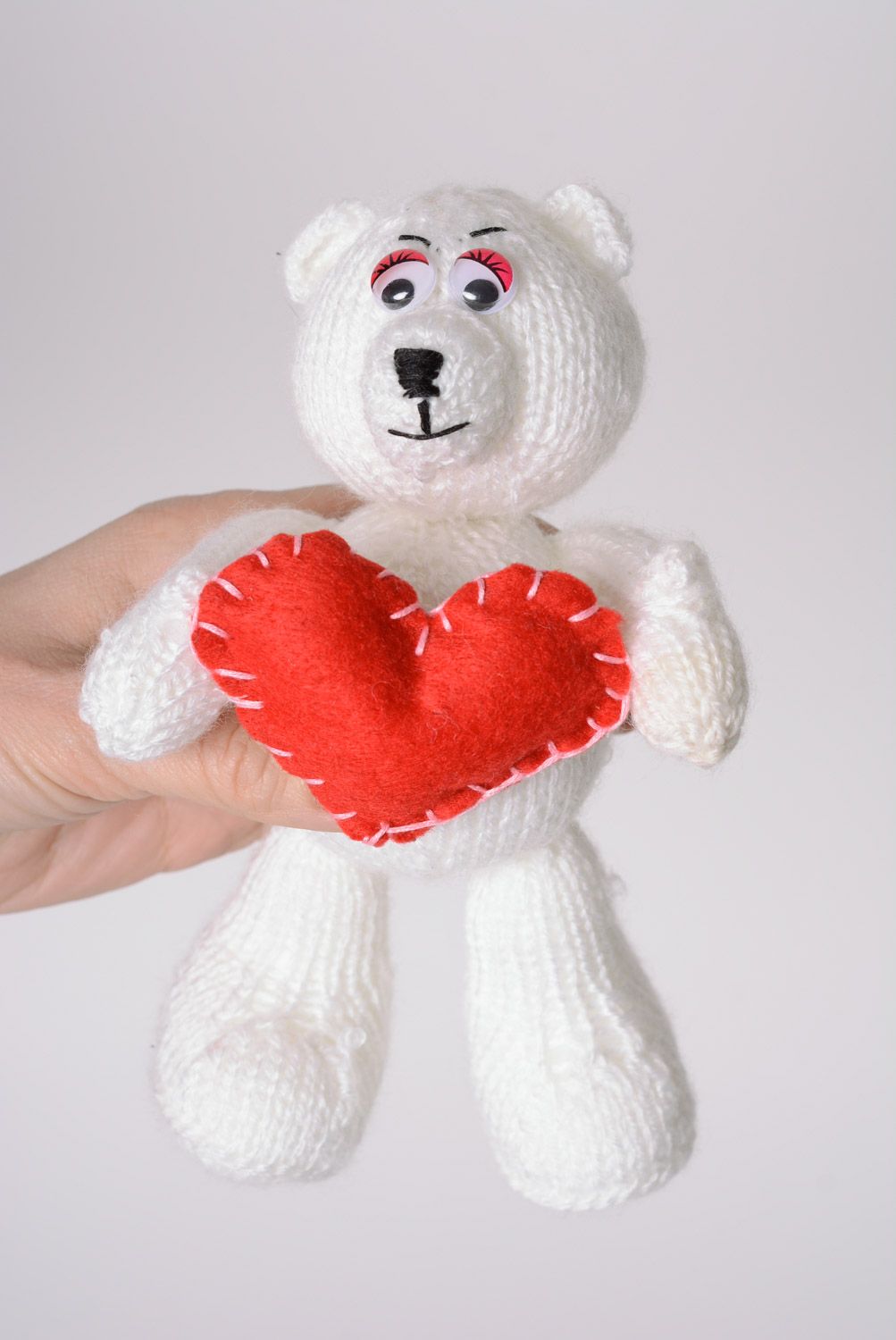 Small handmade soft knitted toy bear with red heart photo 2