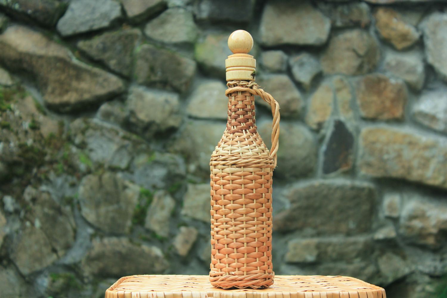 Decorative bottle woven with willow photo 1