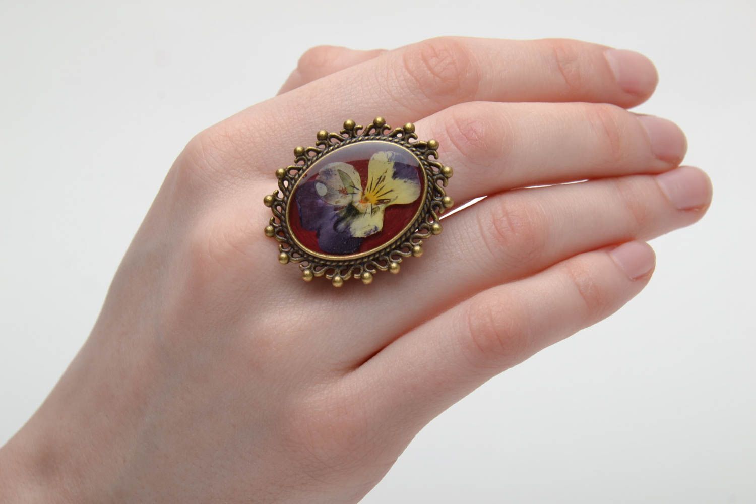 Ring with natural flowers in epoxy resin photo 2