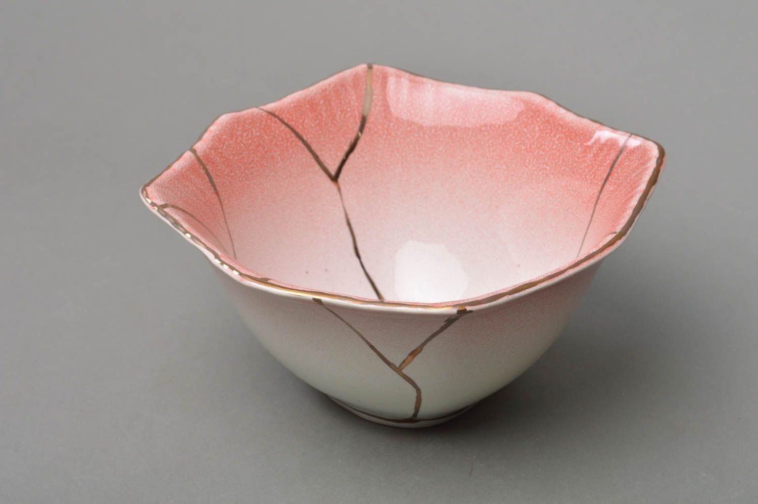 Handmade pink small beautiful salad bowl made of porcelain of unusual shape photo 1