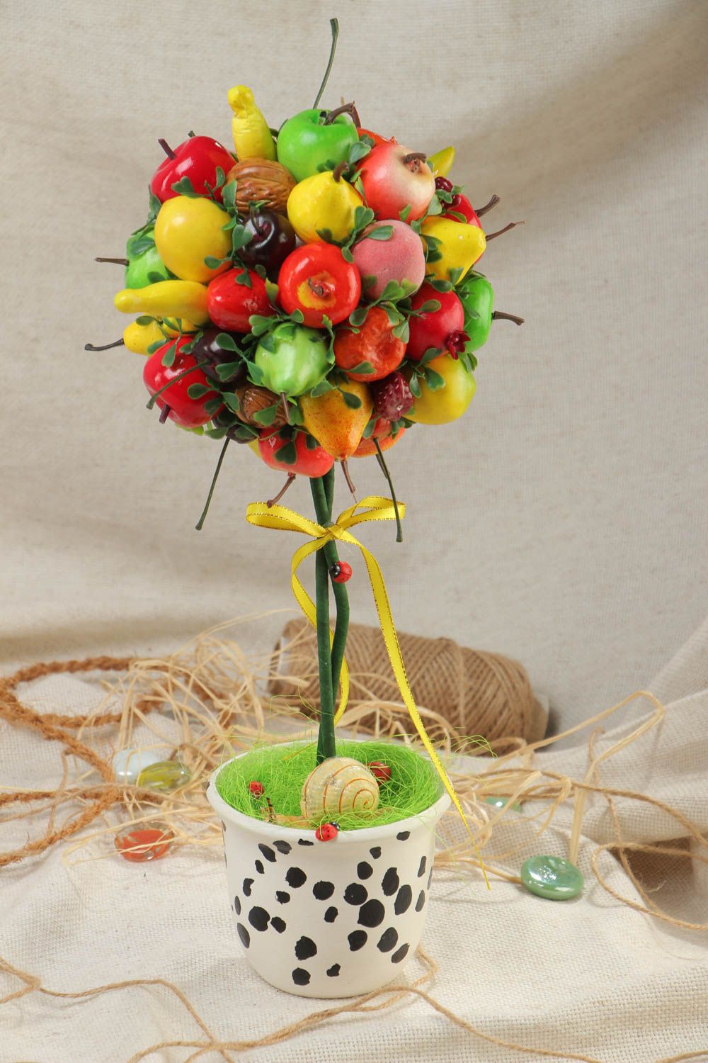 Handcrafted topiary made of artificial fruit in a pot for unique home decor photo 1