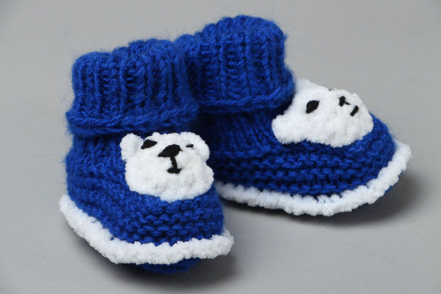 Hand knitted blue baby shoes photo 1