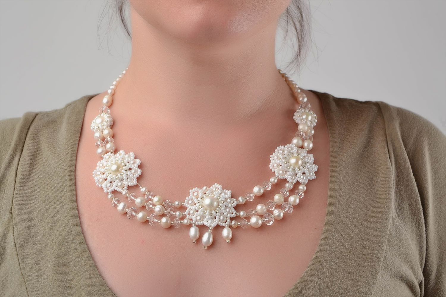 Beautiful festive handmade white necklace made of beads and natural stones photo 1