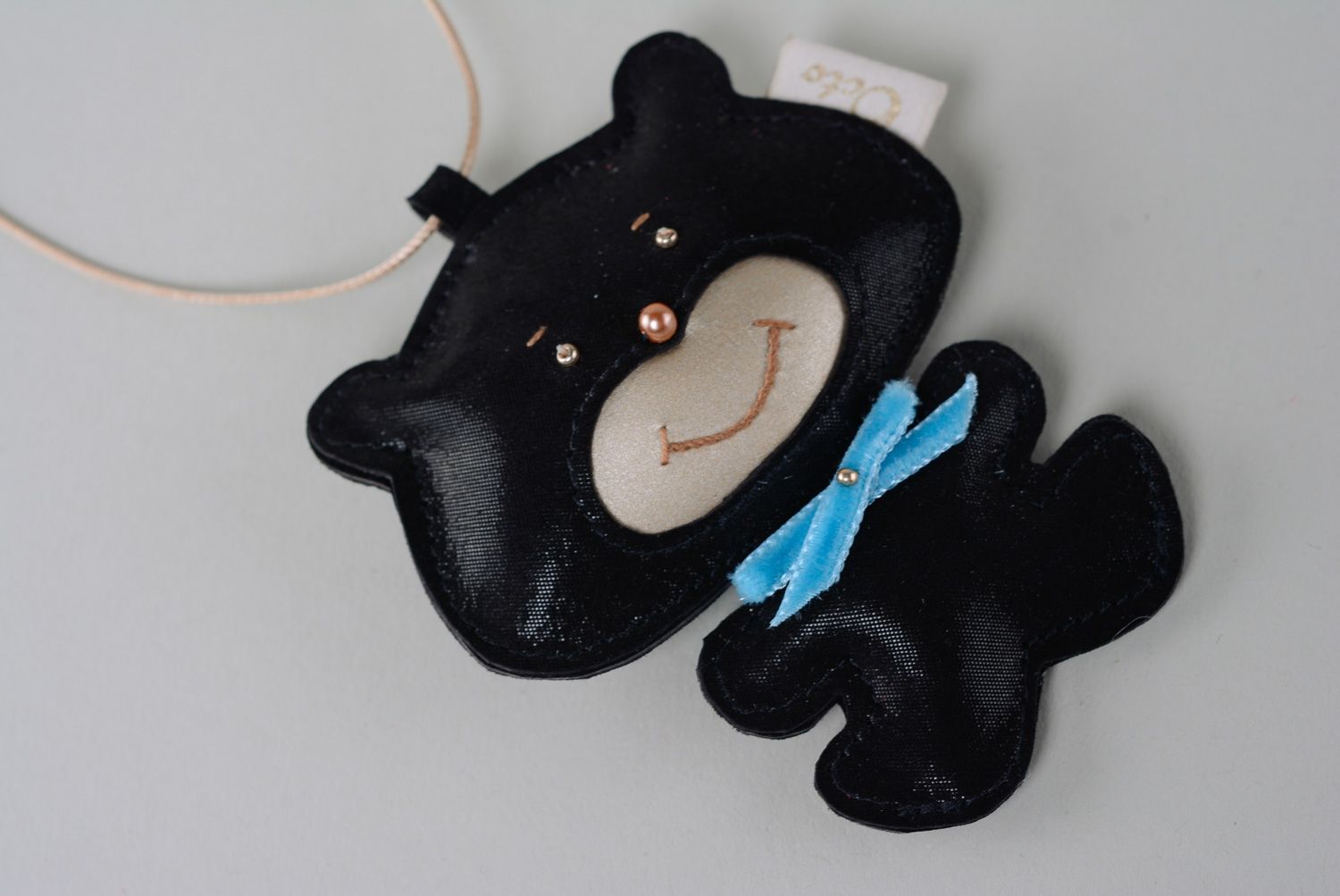 Handmade genuine leather keychain in the shape of black bear with blue bow  photo 4