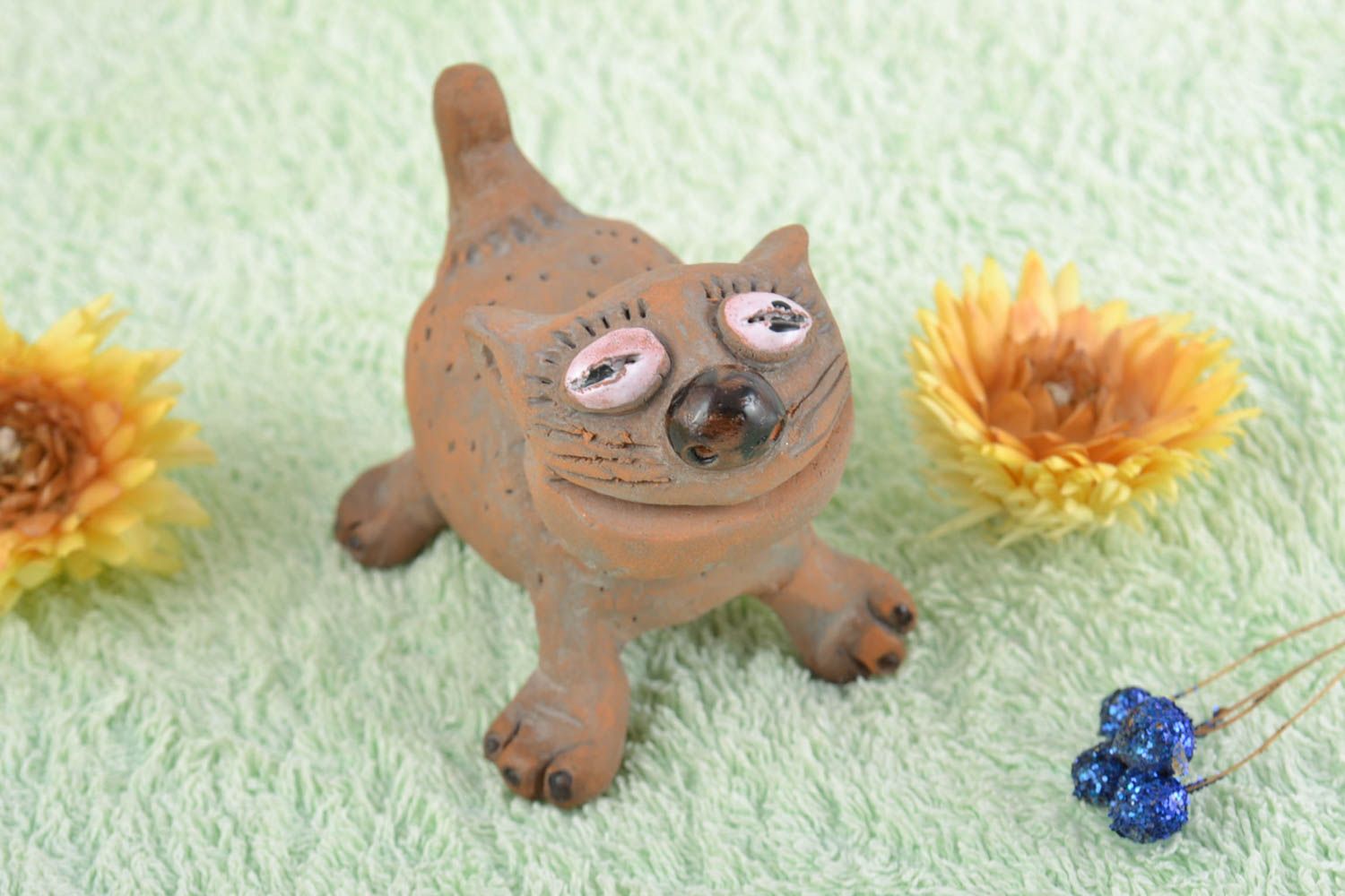 Handmade small collectible ceramic souvenir figurine of cat of brown color photo 1