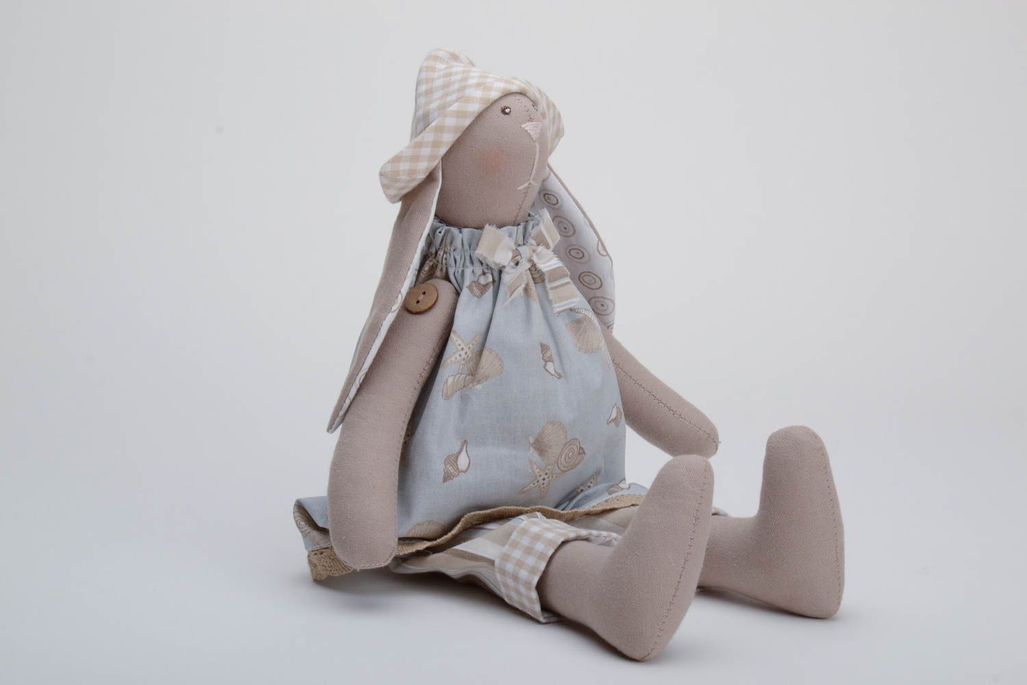 Handmade soft toy sewn of cotton fabric rabbit with long ears in hat and dress photo 2