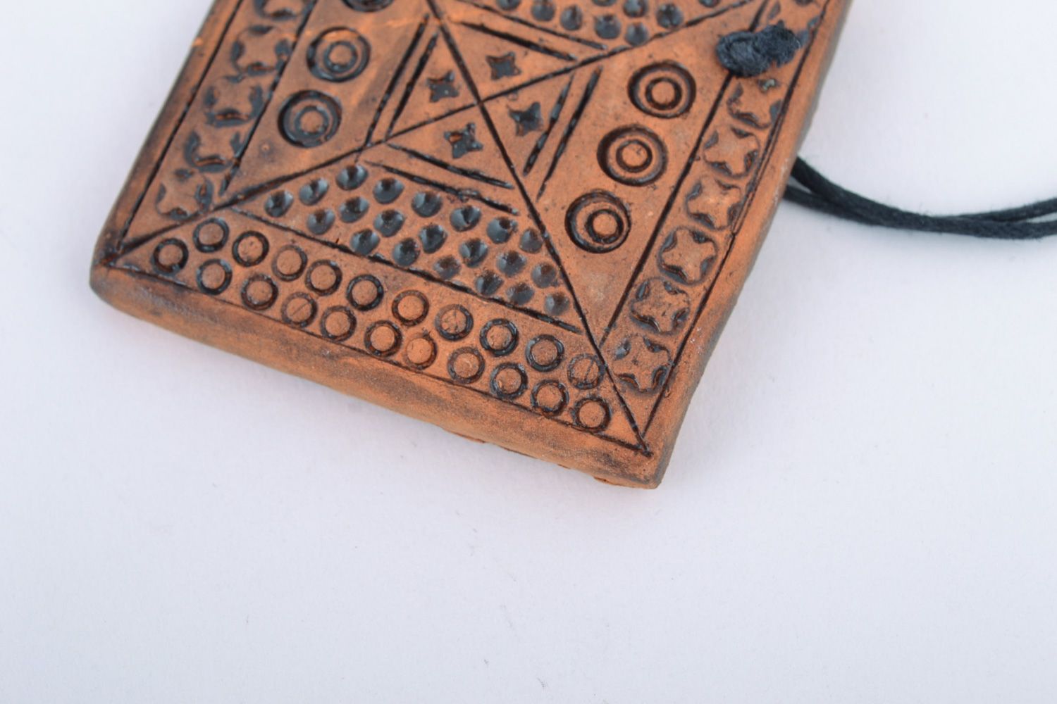Handmade ceramic pendant with relief ornament in ethnic style and long cord  photo 4
