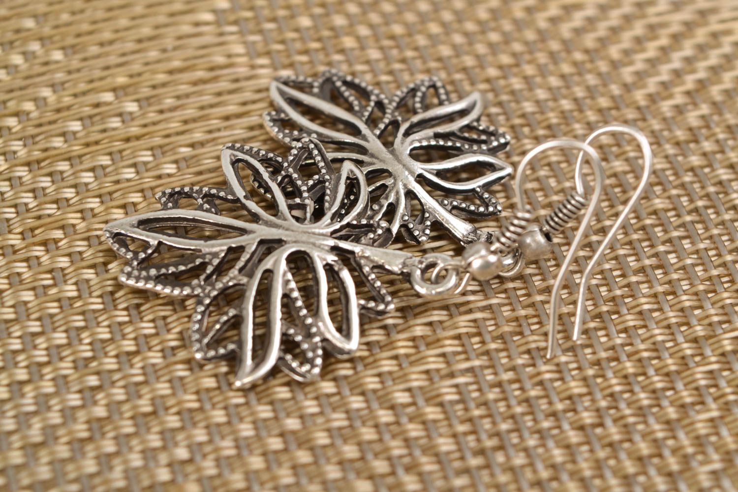 Handmade metal earrings in the shape of leaves photo 1