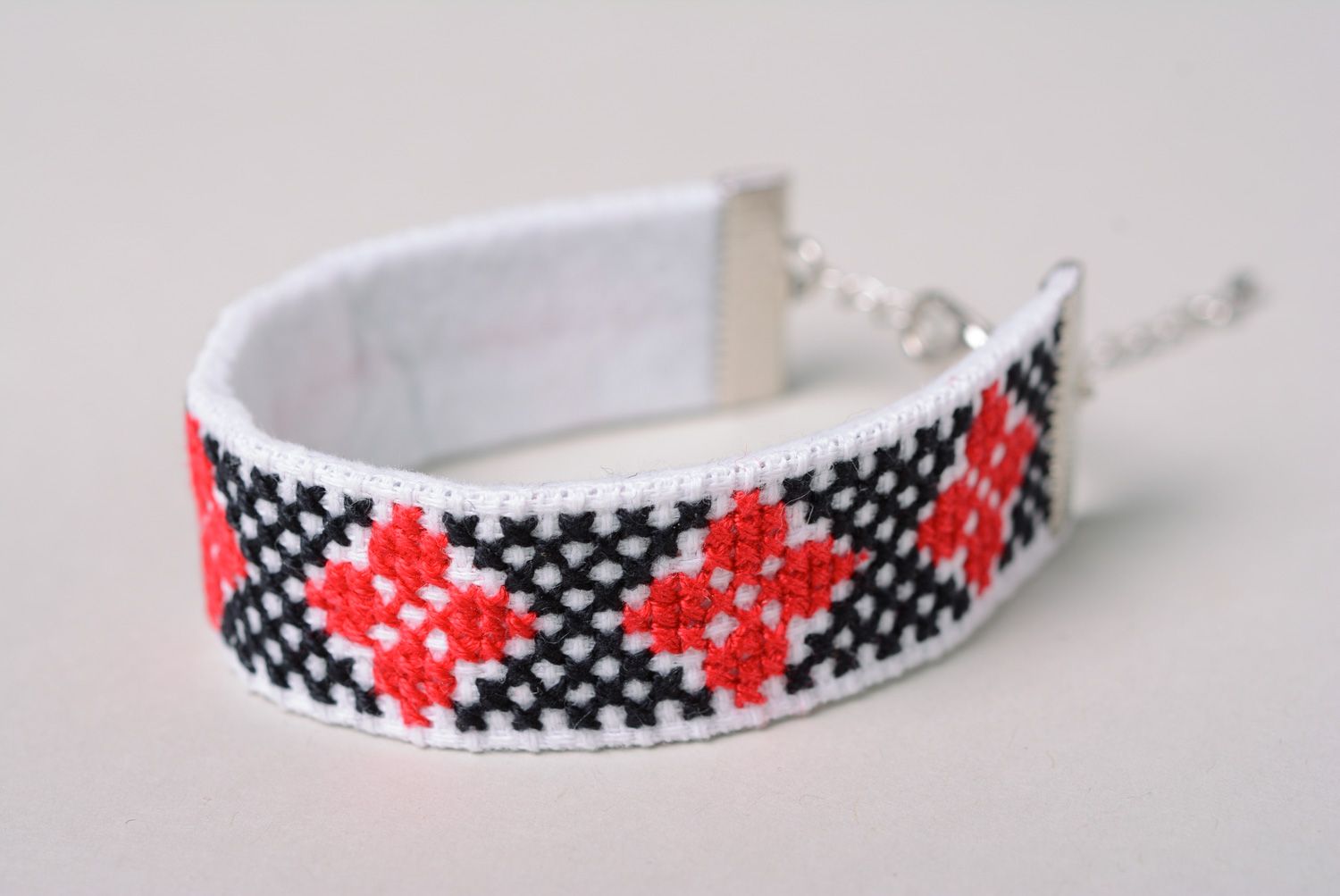 Handmade wrist bracelet with ethnic embroidery in red, white and black colors photo 2