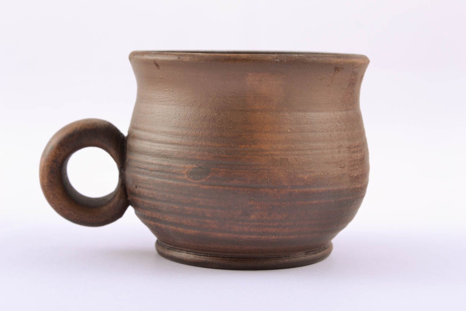 Rustic ceramic teacup in brown color with handle and no pattern photo 1