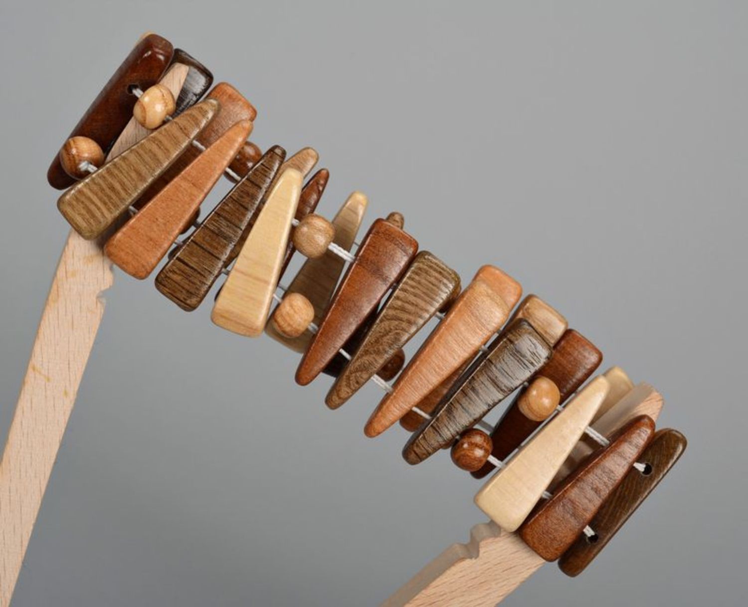 Fashionable wooden bracelet of brown color photo 3