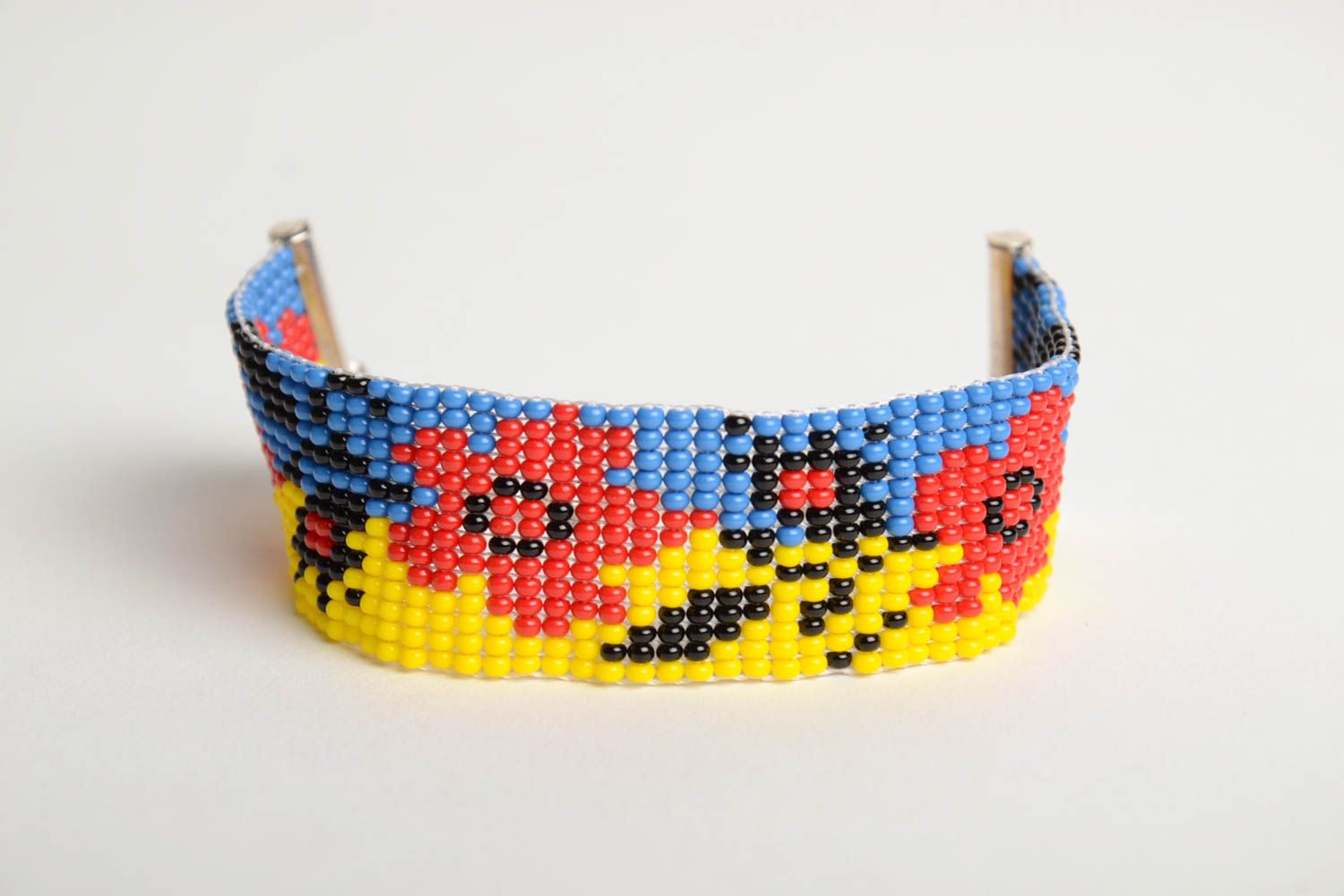Handmade blue and yellow bead woven wrist bracelet with red poppy pattern  photo 3
