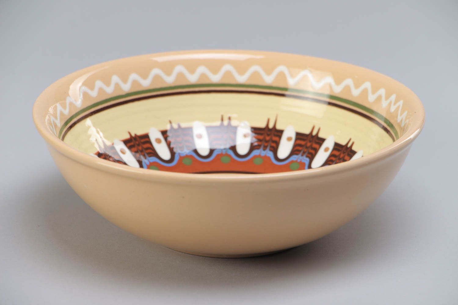 Homemade decorative ceramic bowl painted with glaze in ethnic style for 600 ml photo 2