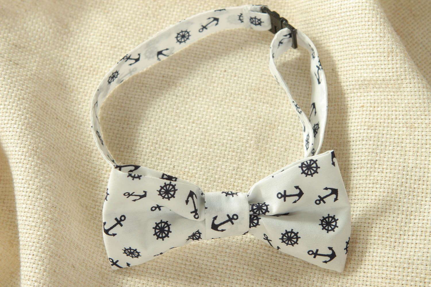 White cotton bow tie with anchors and steering wheels pattern photo 1