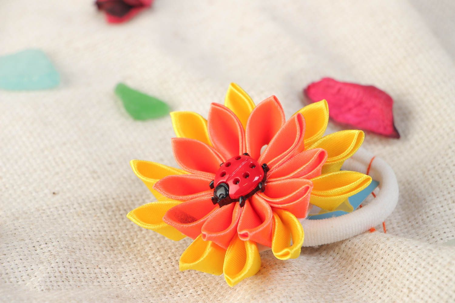 Handmade scrunchy with bright yellow and orange large flower made using kanzashi technique photo 1