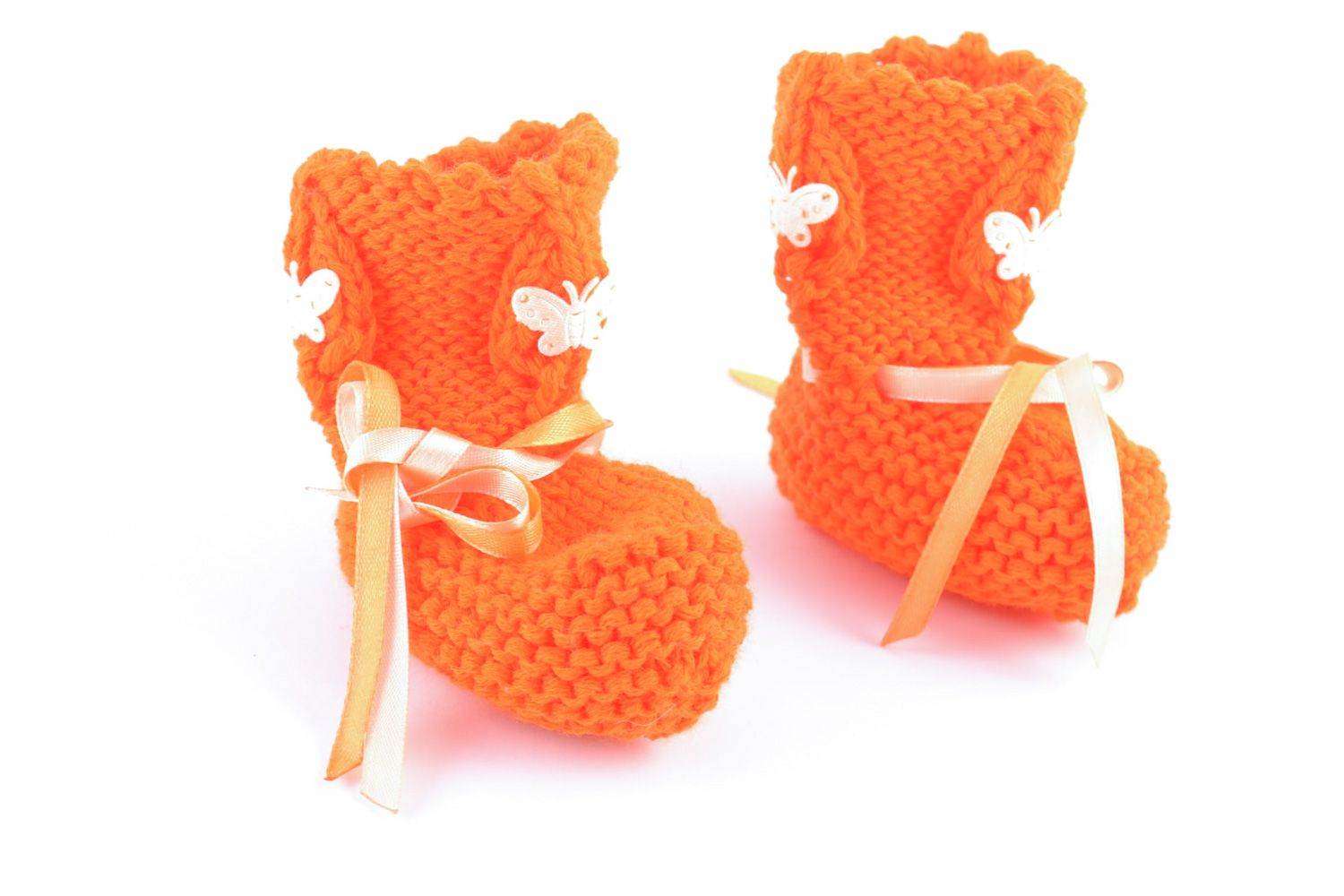 Handmade knitted wool baby bootees of orange color photo 4