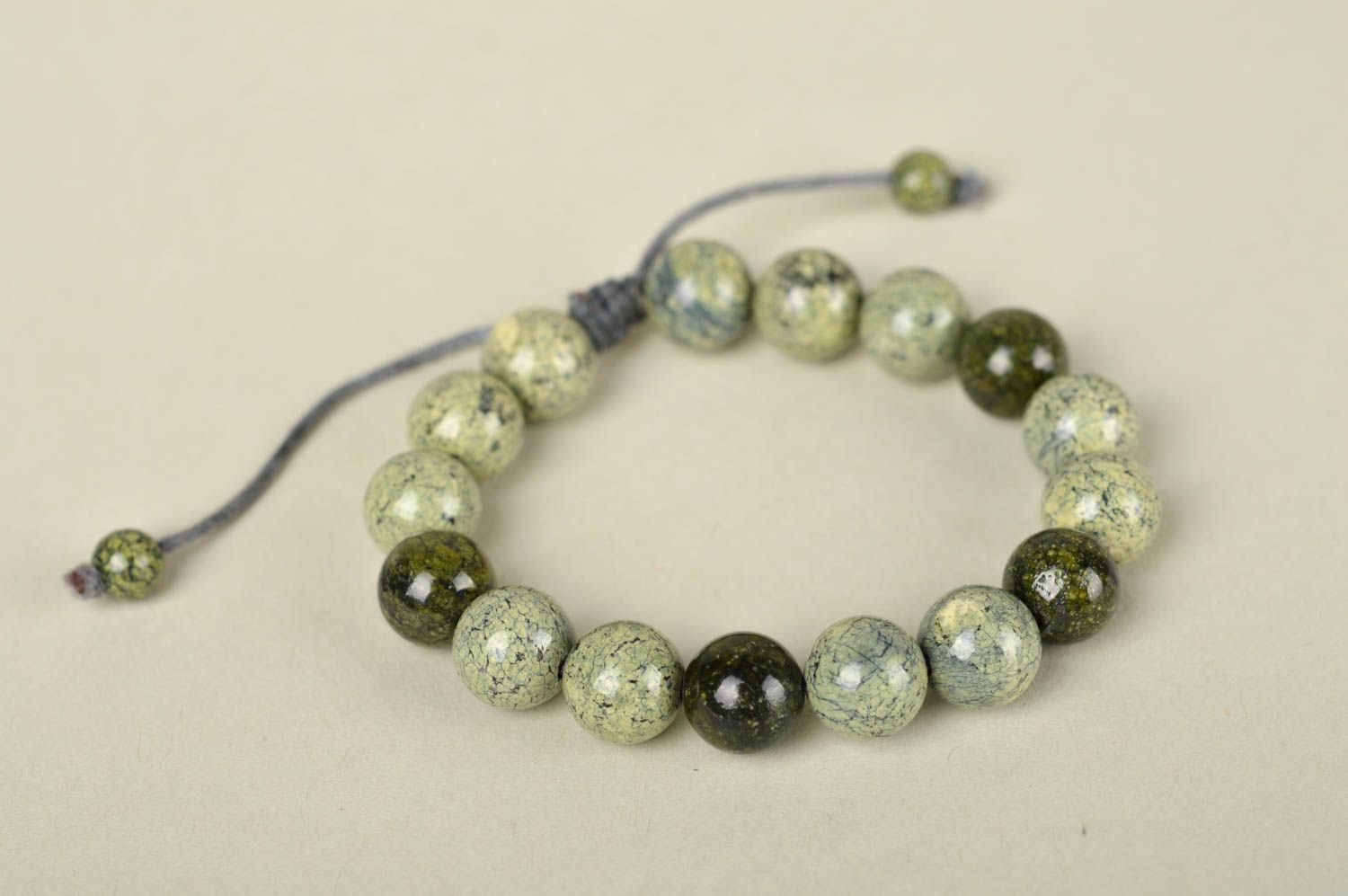 Strand pale green and black beaded bracelet on gray wax cord photo 4