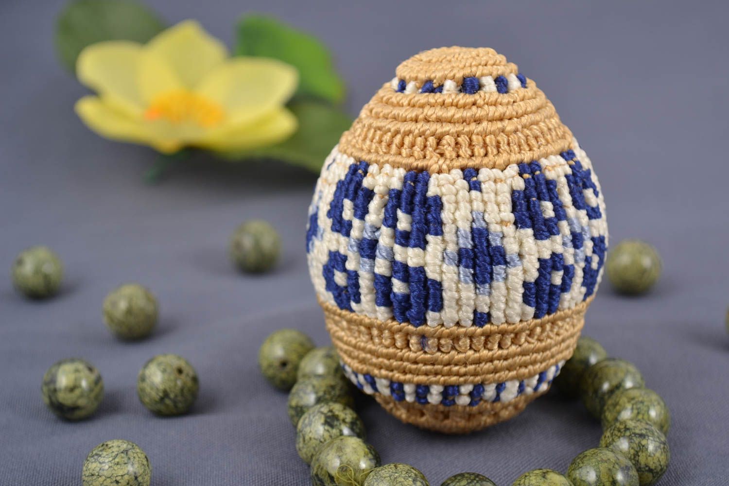 Handmade decorative macrame woven Easter egg on stand blue and beige pattern photo 1