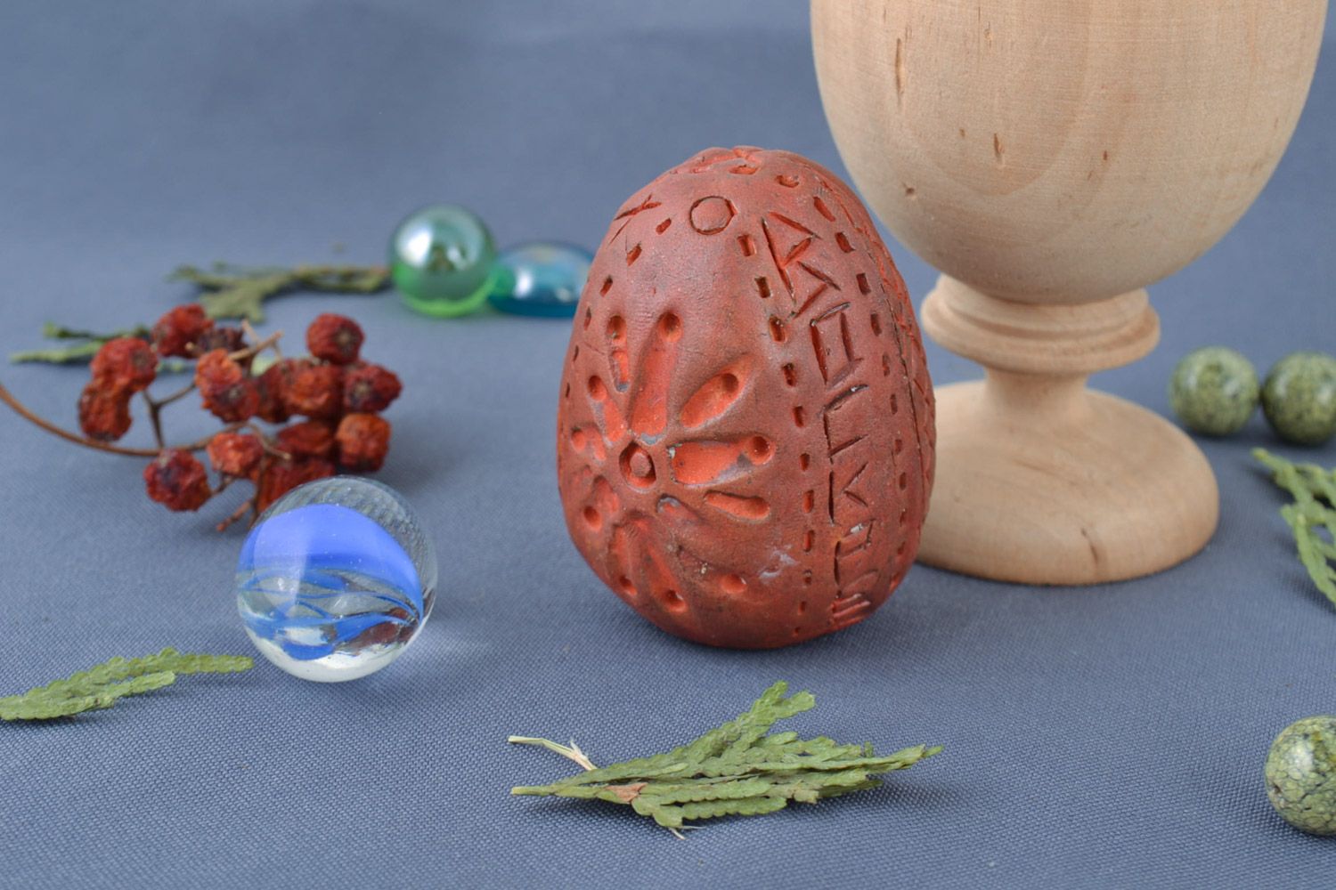 Handmade small decorative ornamented egg of brown color molded of red clay  photo 1