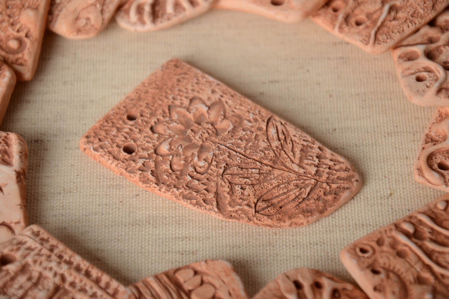 Handmade designer ceramic craft blank for jewelry making with embossed flower photo 1