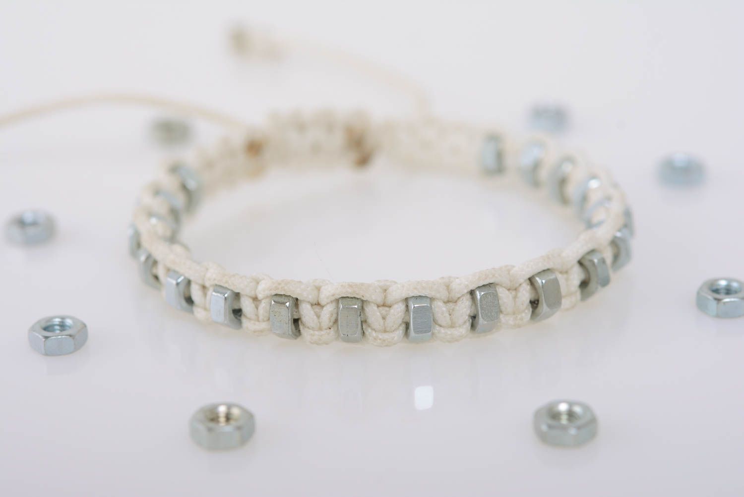 White women's handmade designer macrame woven cord bracelet with steel nuts photo 1