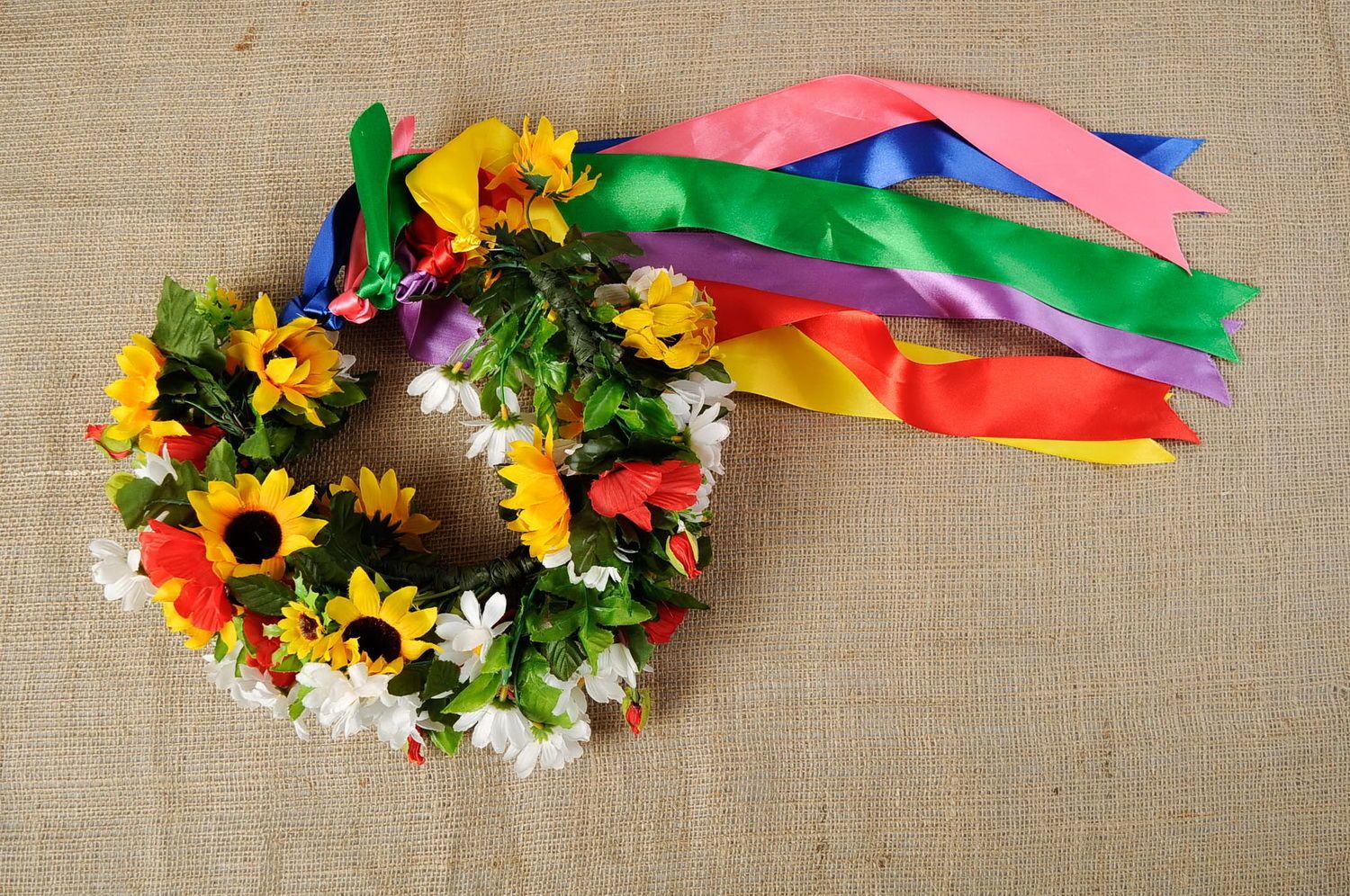 Wreath with decorative flowers and satin ribbons photo 2