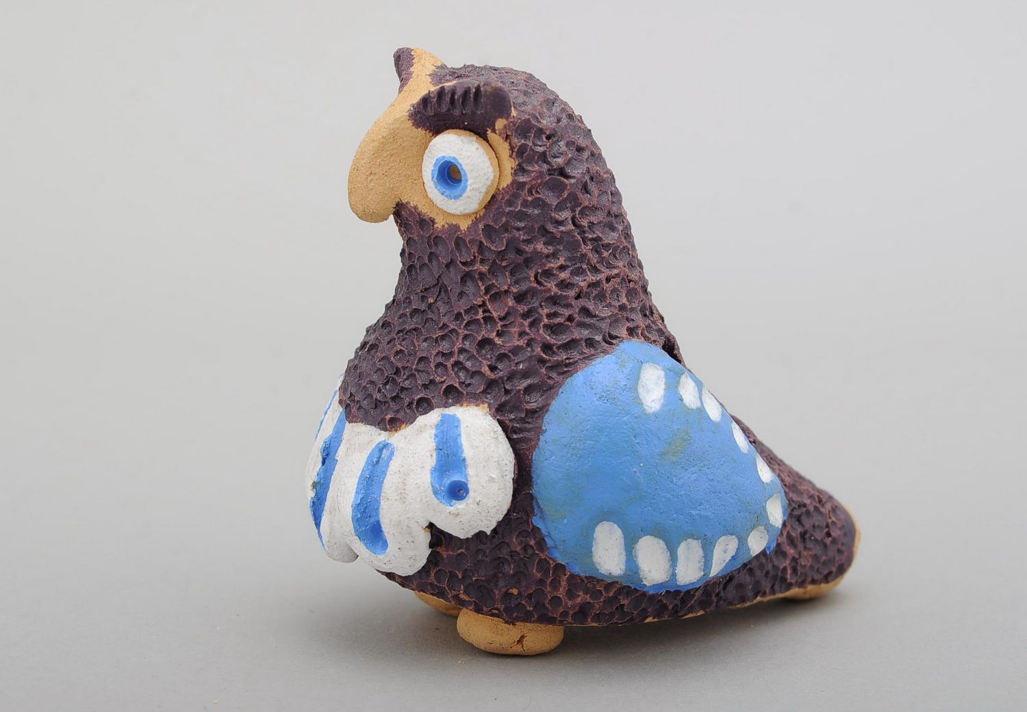 Penny whistle in the form of owl made of clay photo 1