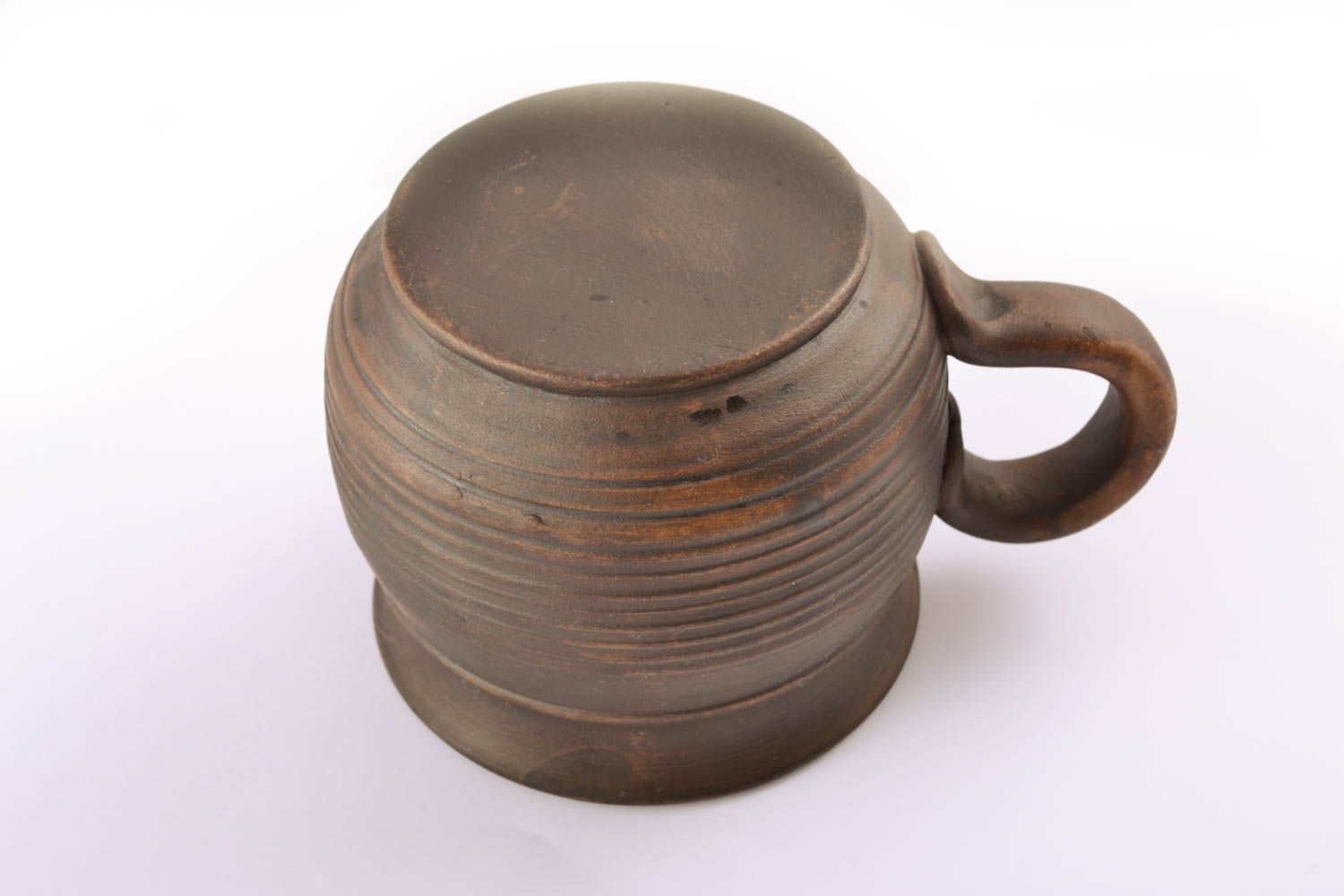 Ceramic drinking cup kilned with milk in rustic design with handle and no pattern photo 3