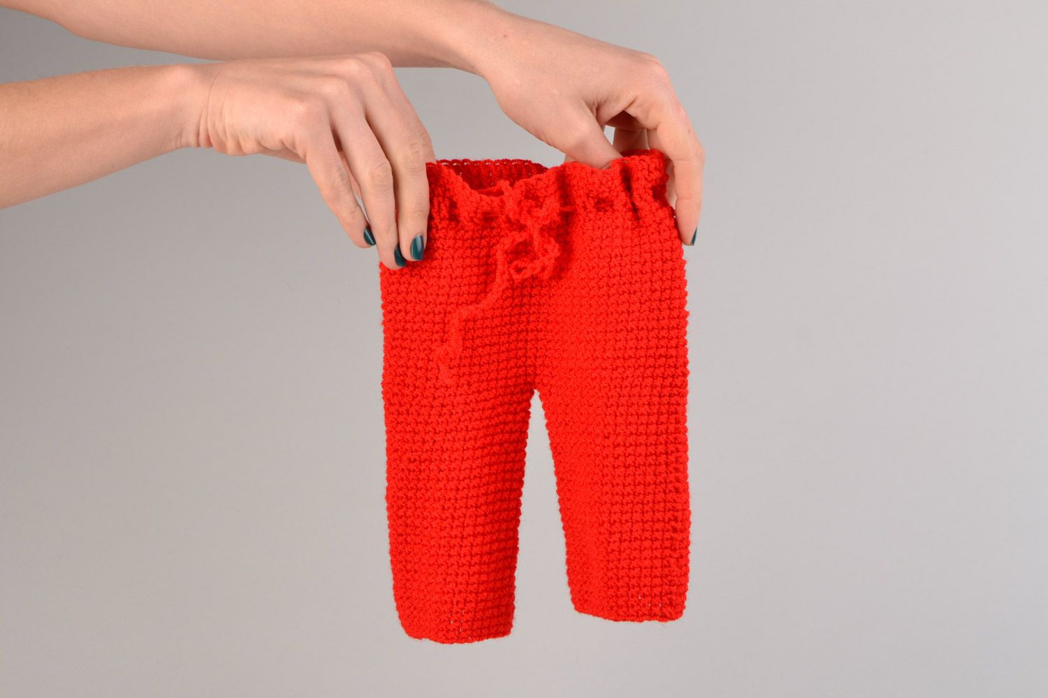Handmade crocheted stylish red baby pants for kids made of acrylic threads photo 1