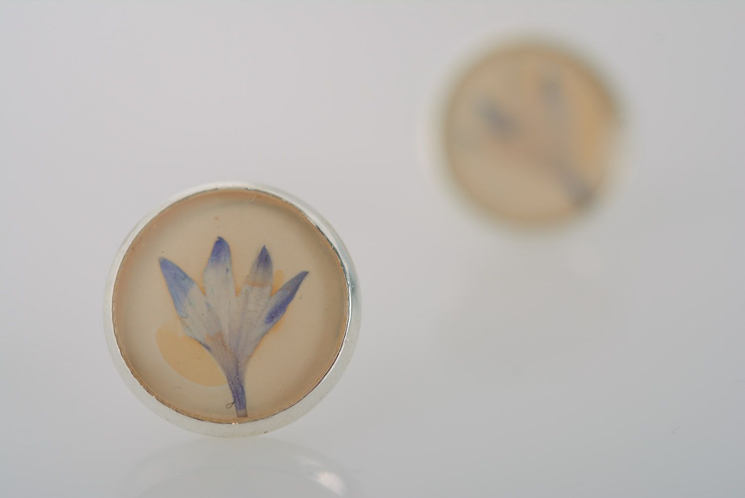 Handmade round stud earrings with natural blue flowers in epoxy resin  photo 5
