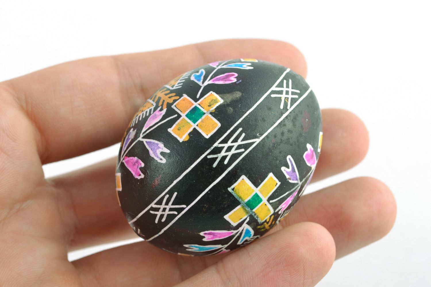 Handmade ornamented Easter egg painted using waxing technique photo 2
