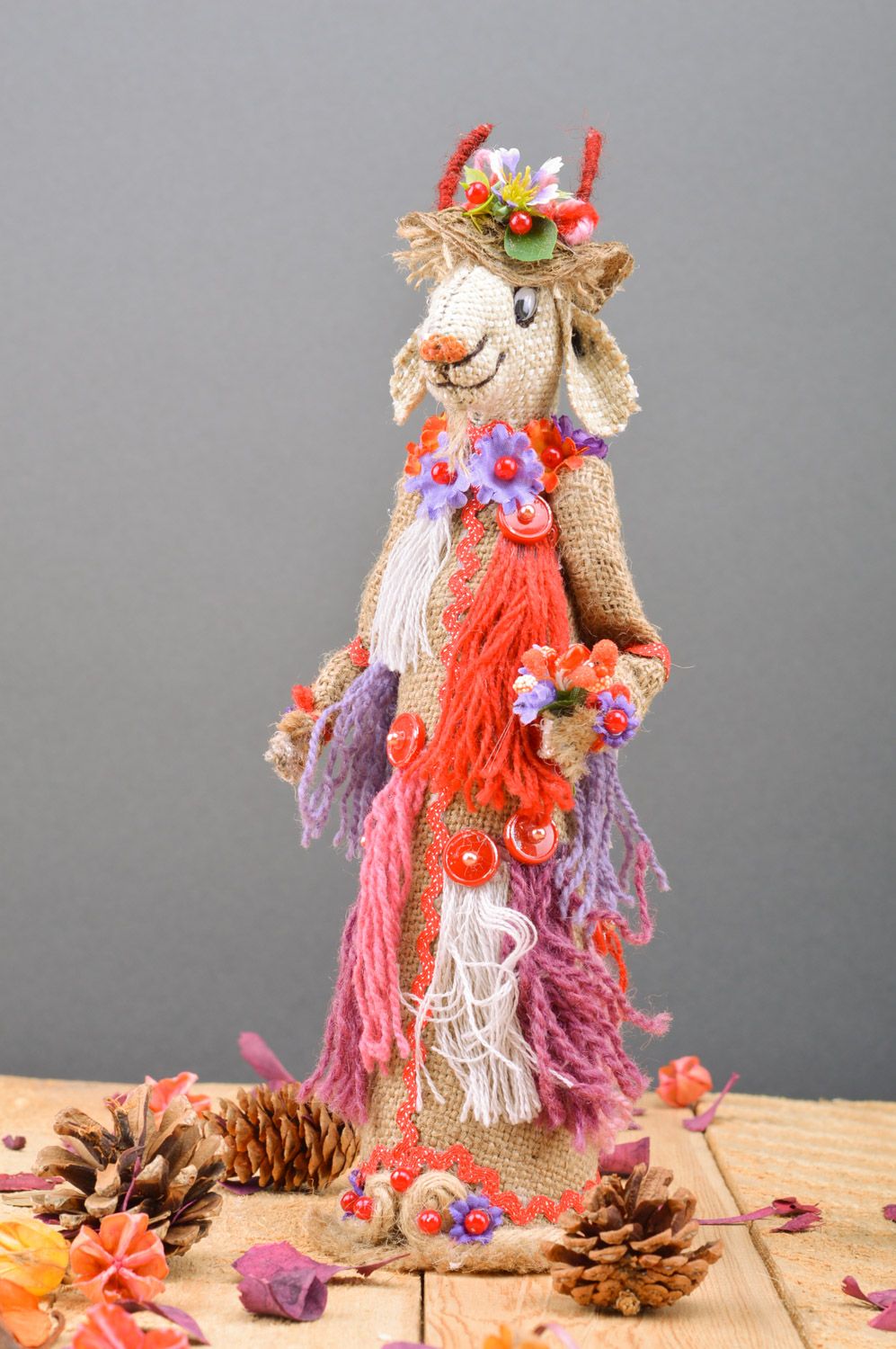 Handmade decorative bottle cozy sewn of burlap Goat in bright ethnic clothes photo 2