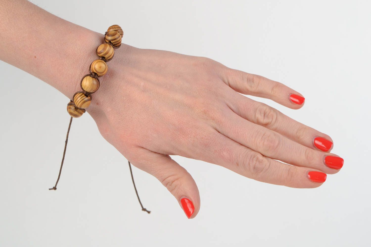 Handmade designer woven cotton cord bracelet with wooden beads photo 3